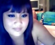 Beautiful asian teen plays with her toy