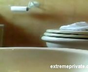 Hidden camera my Mom shaving pussy on toilet