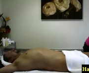Asian masseur massages his hard cock